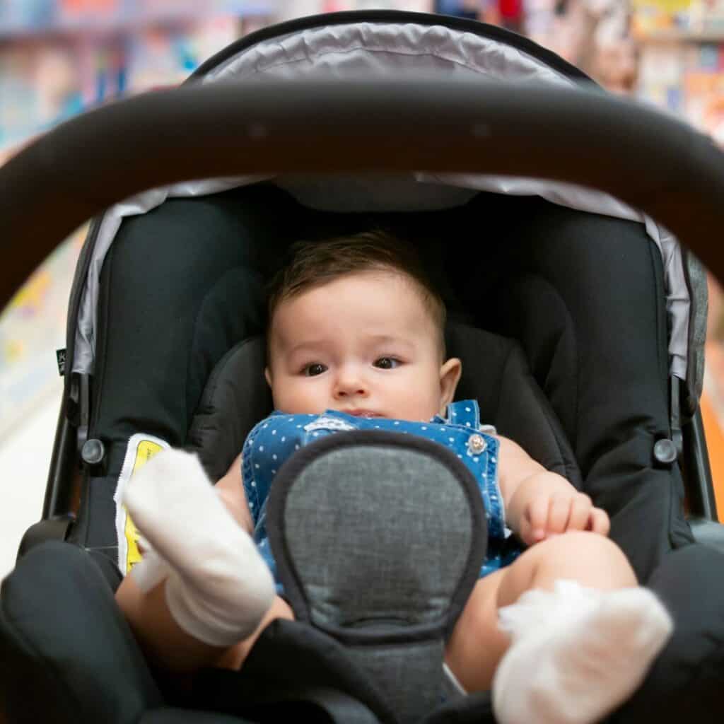 a baby in a stroller at the grocery store answering the question can i bring my baby to costco